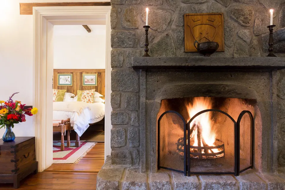 Gibb’s Farm Deutsches House fireplace and bedroom