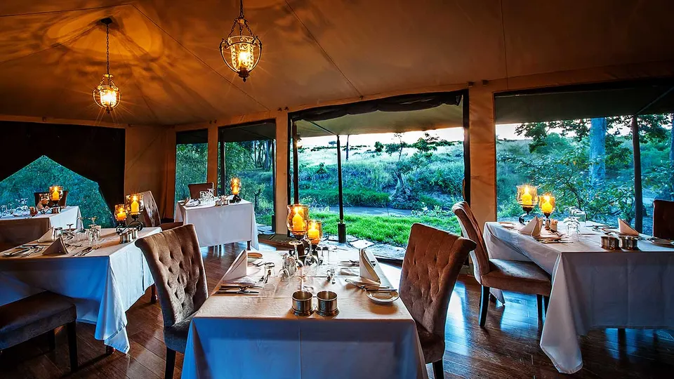 Sand River Masai Mara dining tent at dusk