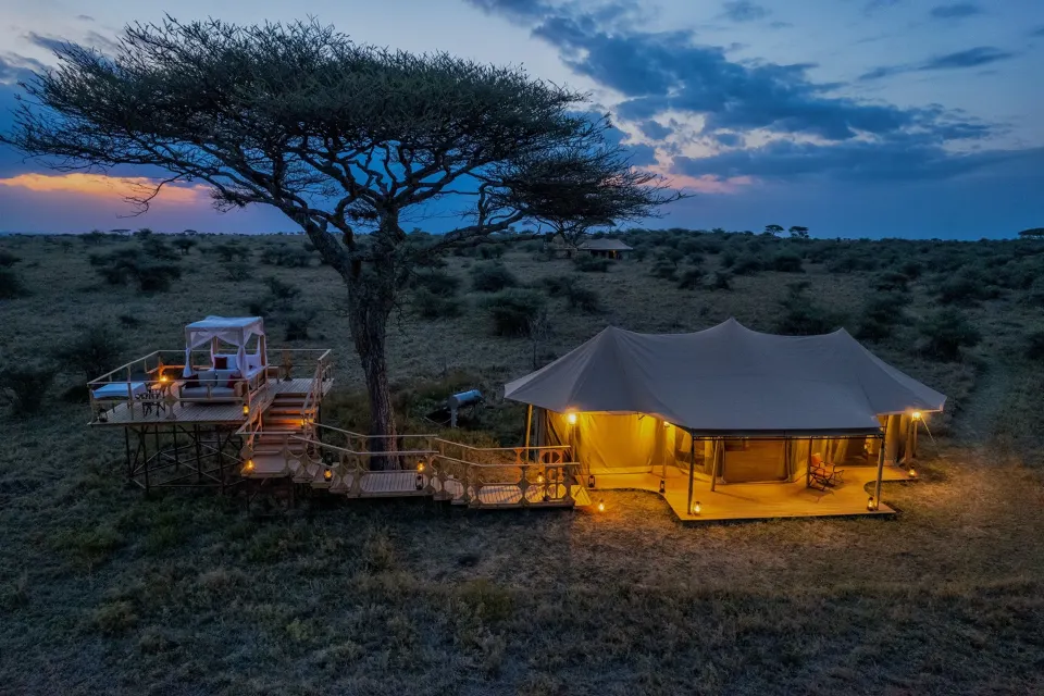 Olmara tent and elevated deck at dusk