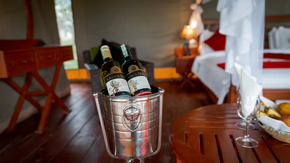 Staged drinks in an Embalakai guest tent; photo does not establish complimentary inclusion