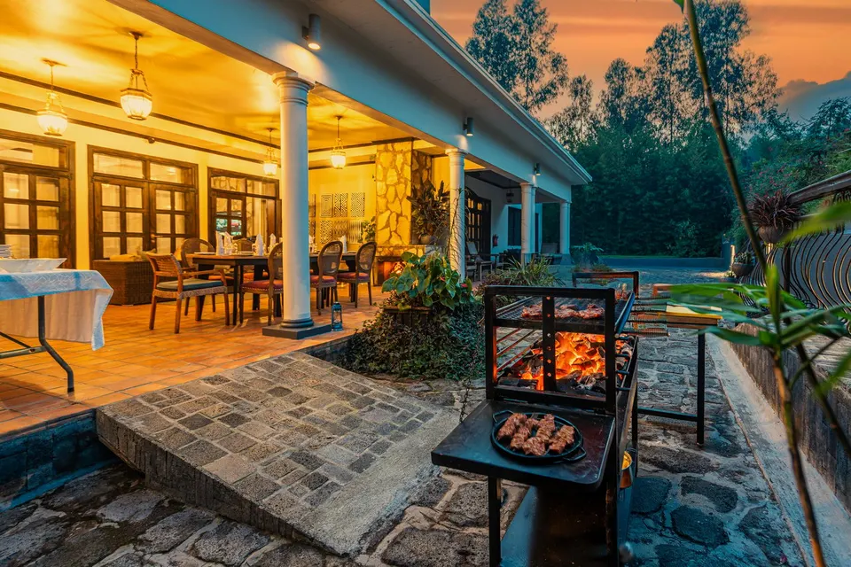 Private garden terrace with fireplace and barbecue at the Volcano Manor, Five Volcanoes Boutique Hotel Rwanda