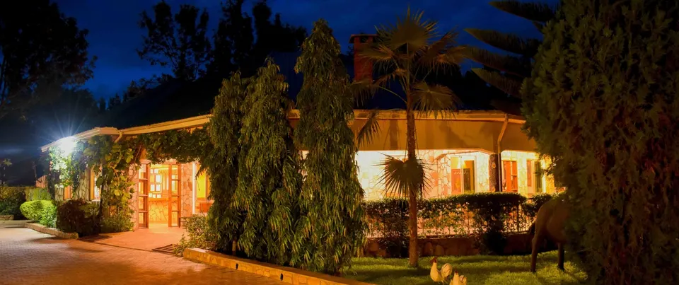 Country Lodge illuminated cottage exterior