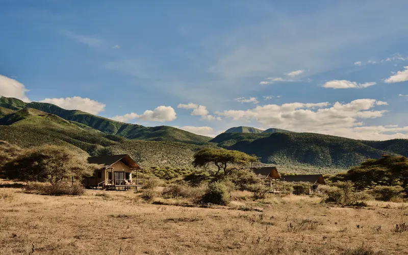 Wide view of the new2026 hillside camp and tent roofs