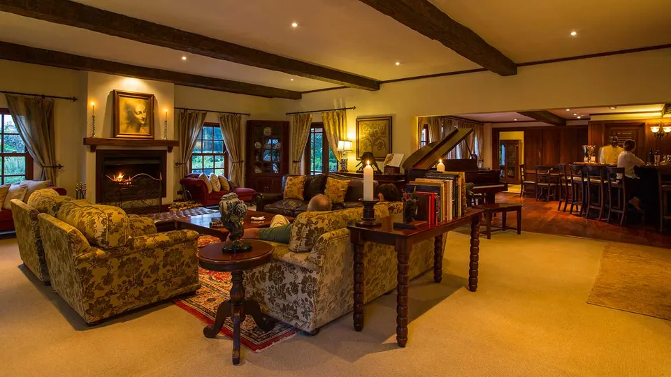 Main Manor lounge with fireplace and seating