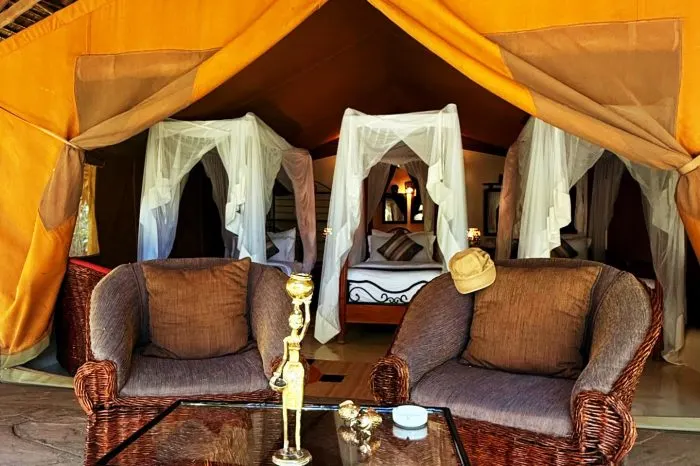 Tent interior with multiple beds and sitting space