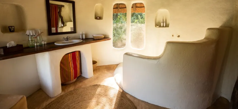 Bathroom shaped around the natural rock setting