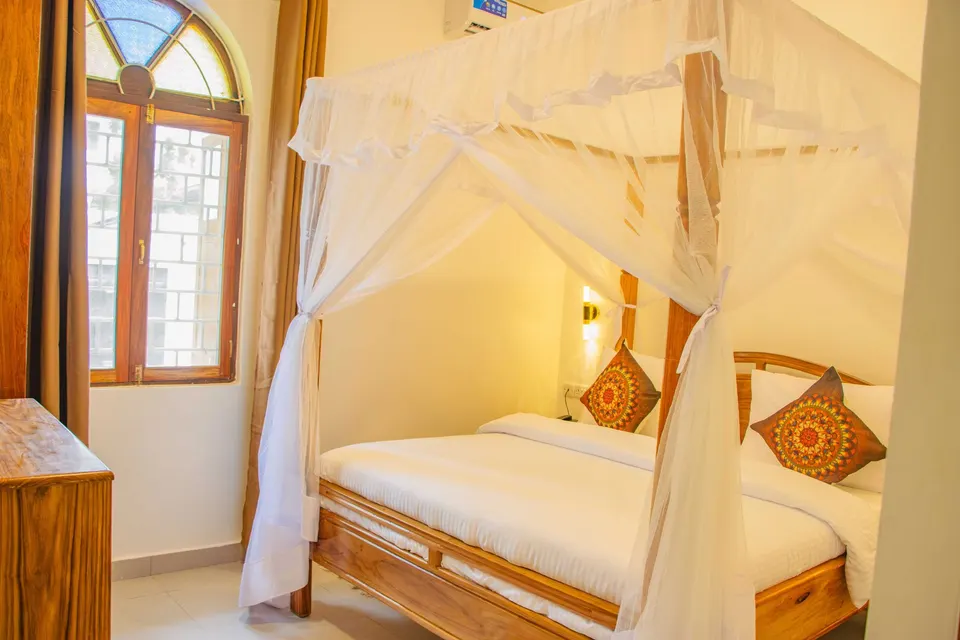 Guest room with wood-framed windows