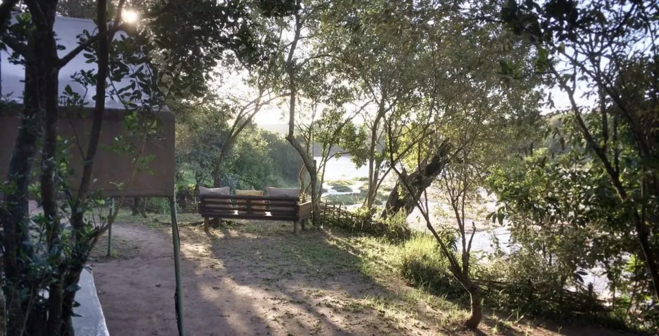 Nkorombo riverside camp clearing and deck