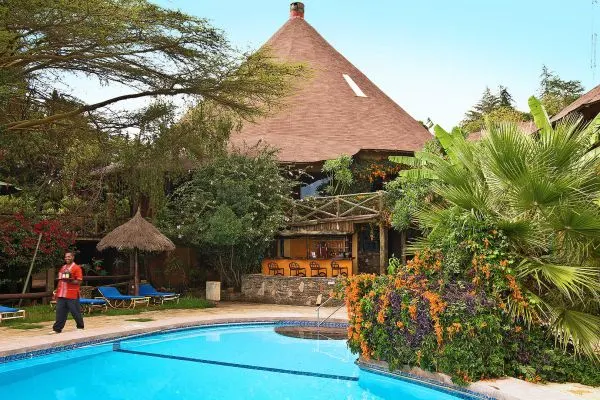 Masai Mara Sopa Lodge swimming pool and thatched buildings